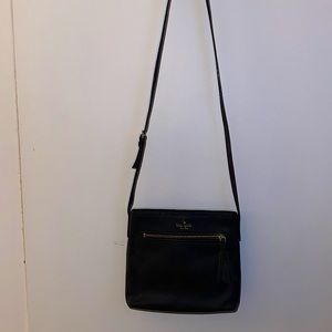 Kate Spade black leather cross body bag with tassel.  Very clean, used once.